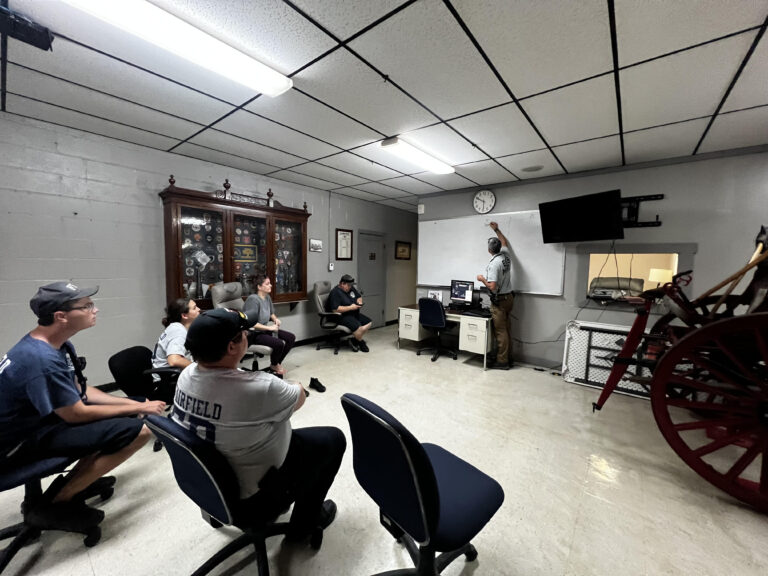 An MD3 instructor teaching EMS providers in a fire station training room